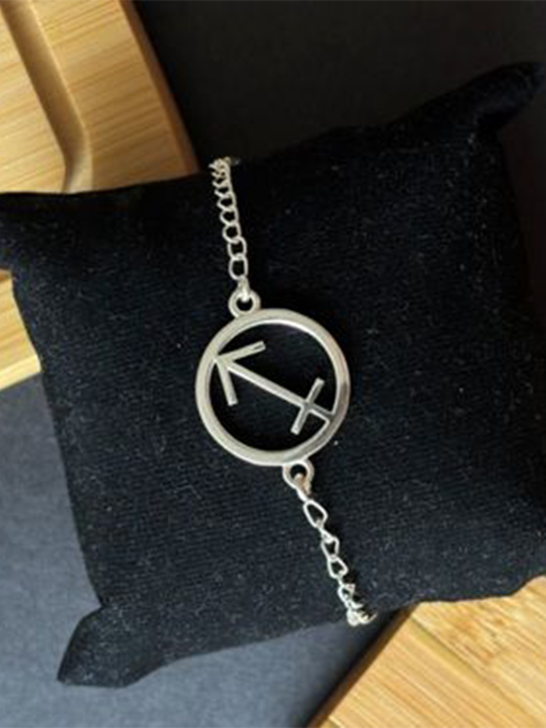 SANAA CREATIONS Silver-Plated Sagittarius Charm Wraparound Rakhi