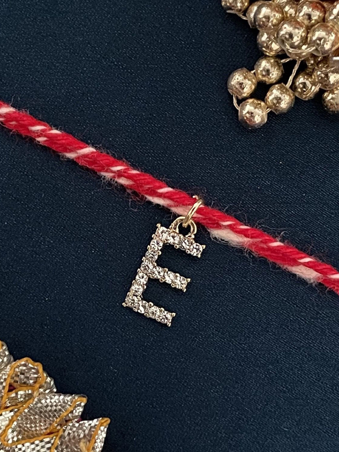 Digital Dress Room Gold Plated E Alphabet AD Studded Initial Thread Rakhi