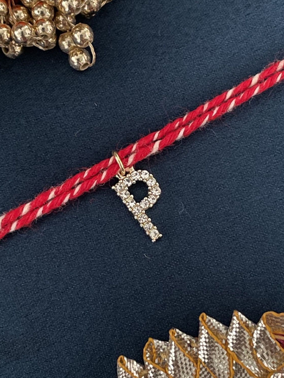 Digital Dress Room American Diamond Studded P Letter Thread Rakhi