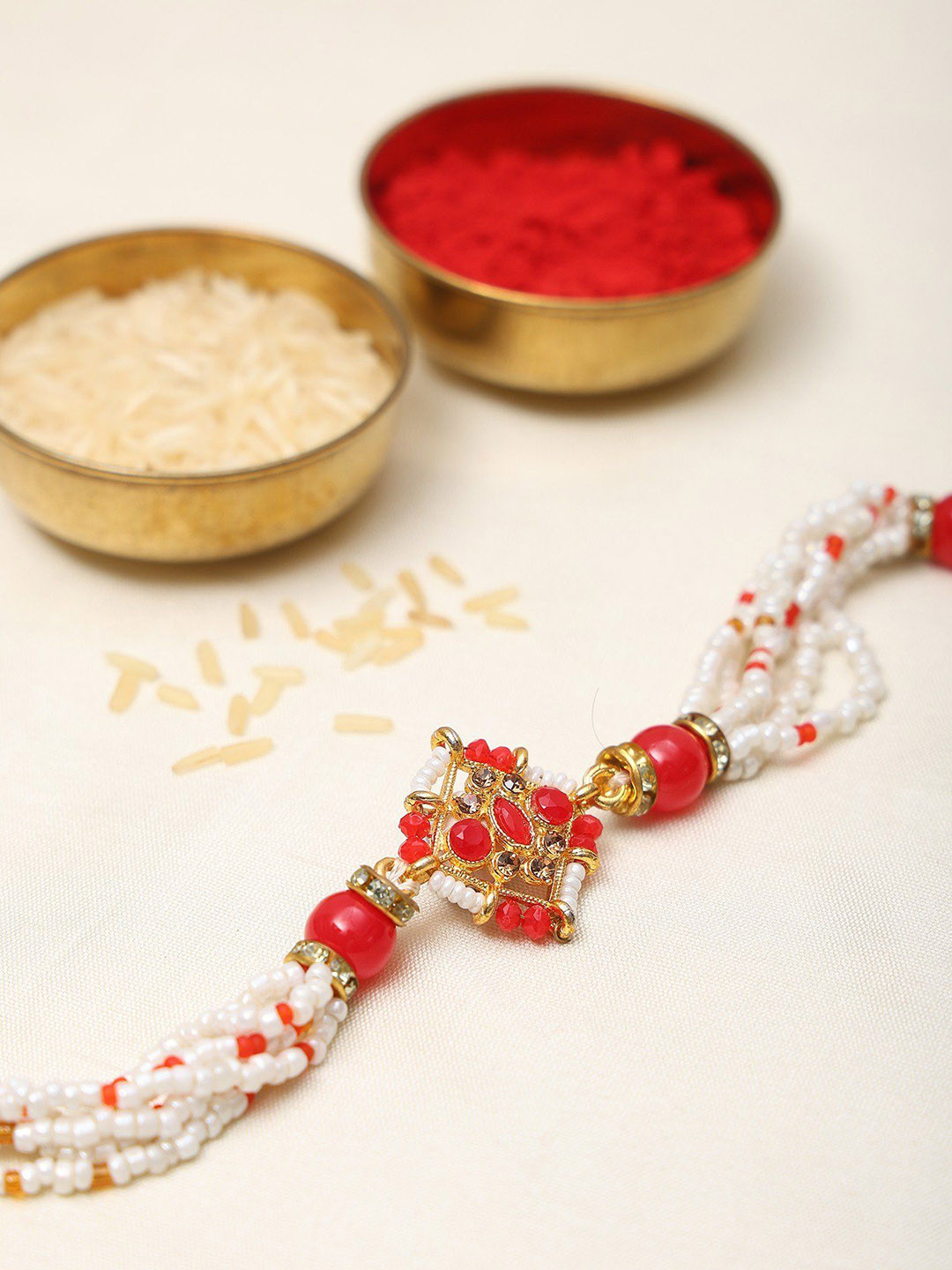 Exotic India Stone Studded and Beaded Diamond Shape Adjustable Bracelet Rakhi