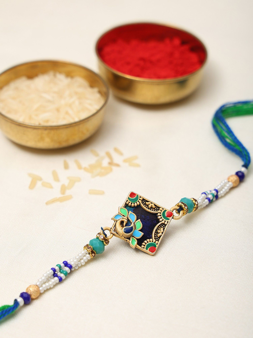 Exotic India Stone Studded & Beaded Enamel work Peacock Thread Rakhi