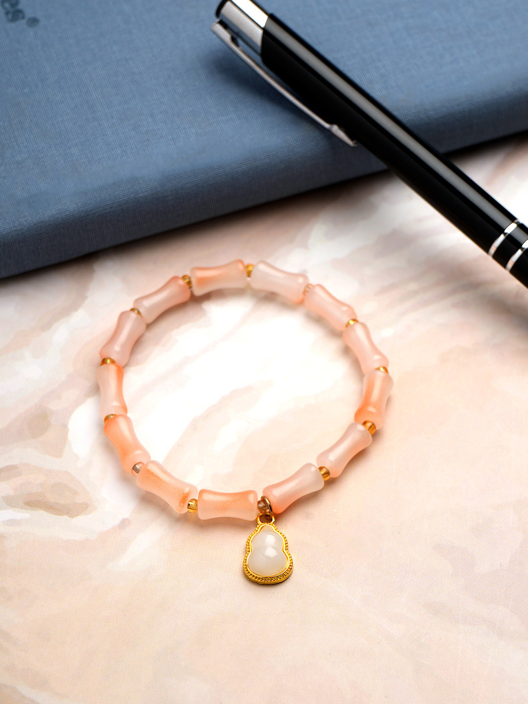 Archies Soft Blush Golden Charm Bracelet