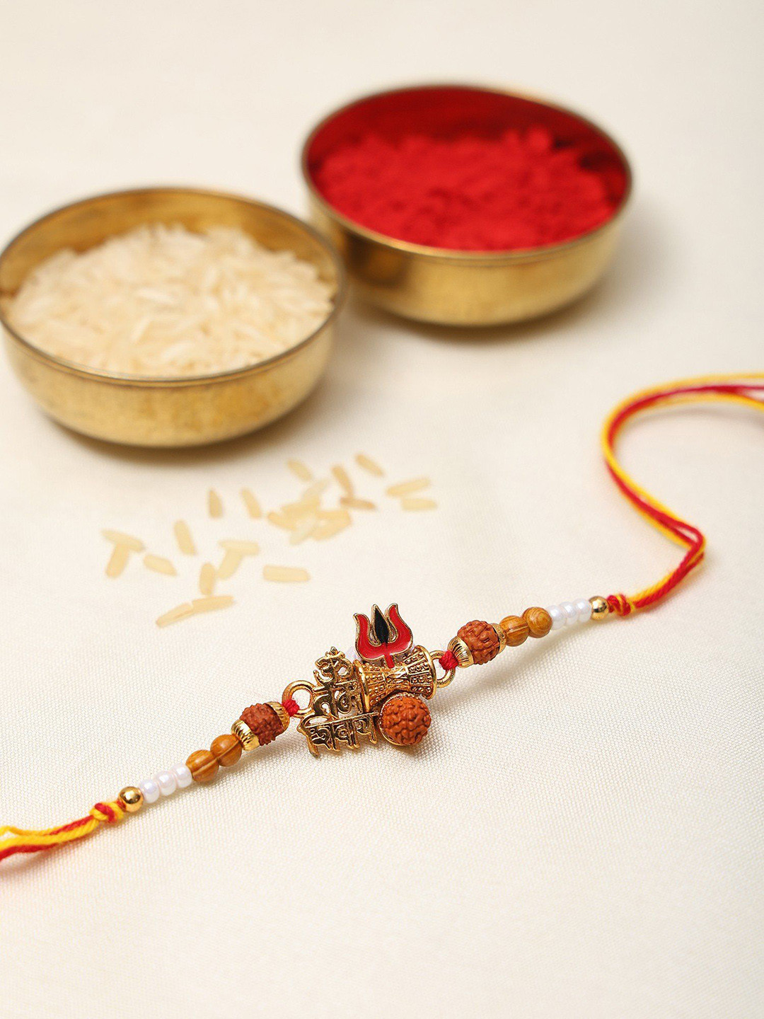Exotic India Beaded Om Namah Shivay Thread Rakhi with Trishul and Damru