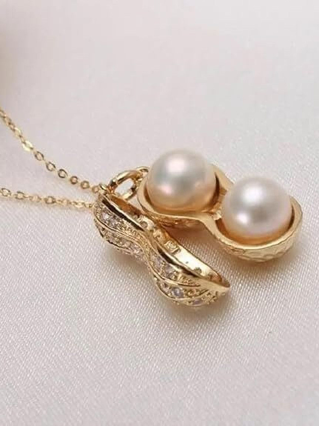 Heer Collection  Stainless Steel Pearls Studded Peanut Shaped Pendant With Chain