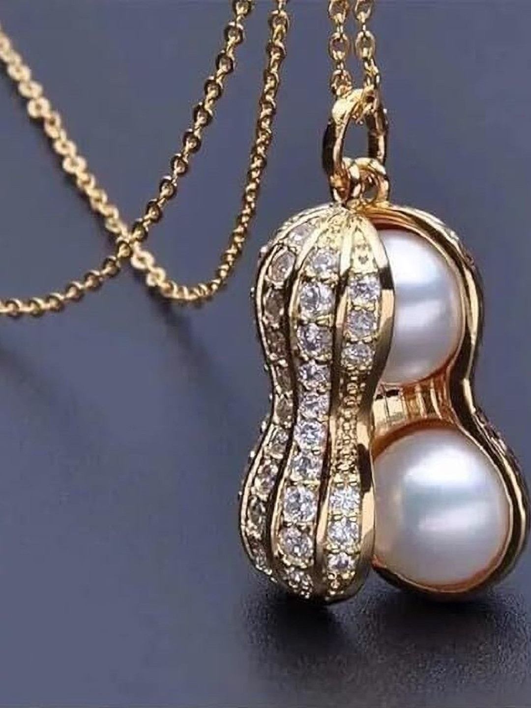 Heer Collection  Stainless Steel Cubic Zirconia Studded Peanut Shaped Pendant With Chain