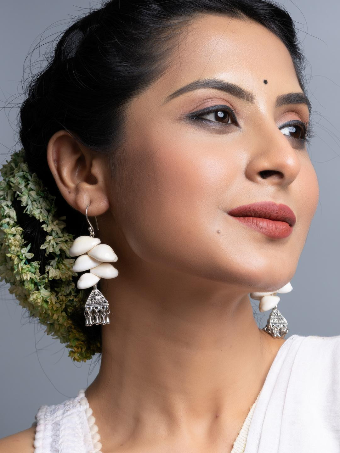 Look and Adorn Cowrie German Silver Jhumka Earrings