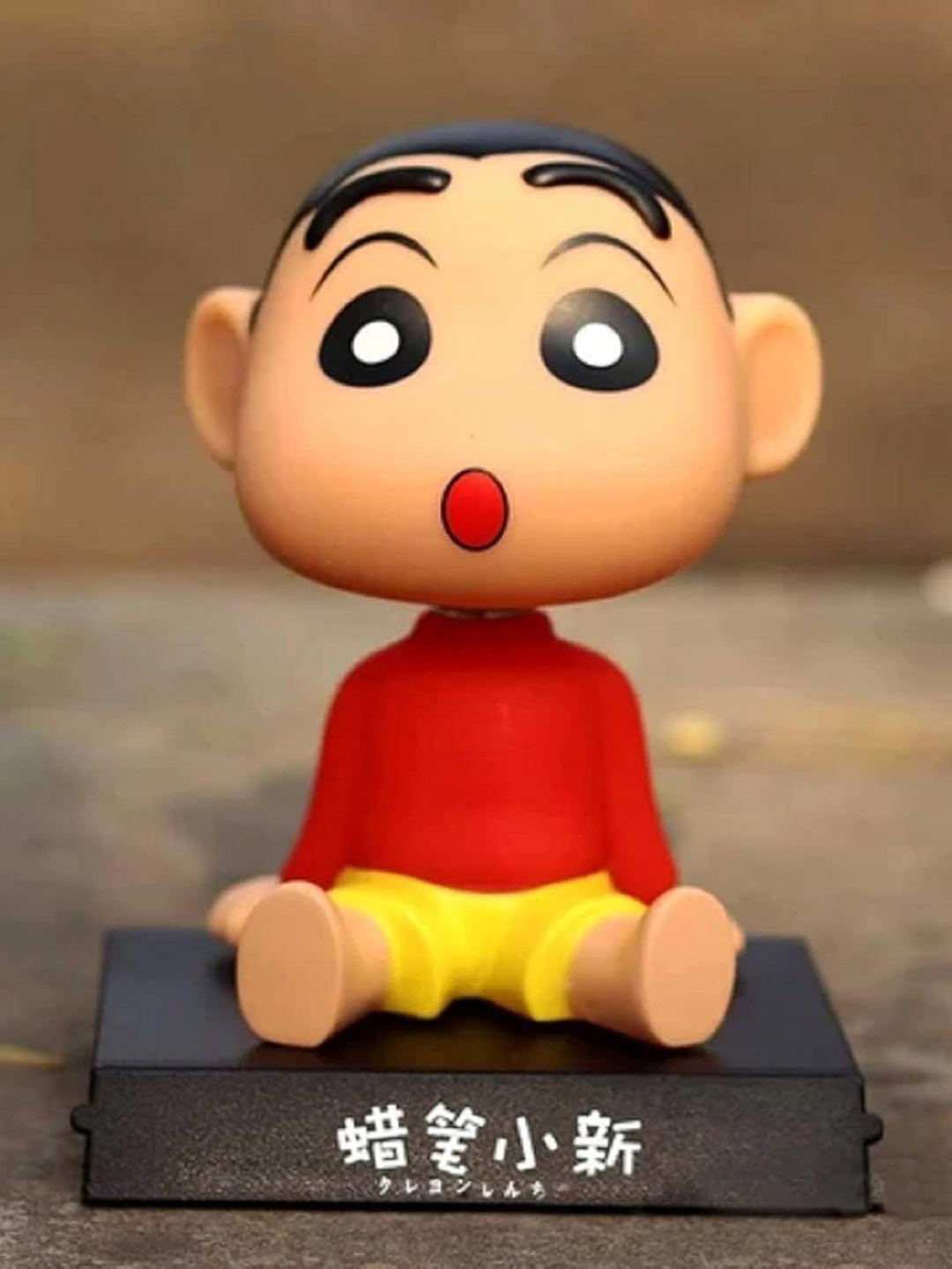 AUGEN Red & Yellow Shinchan Figurine Showpiece
