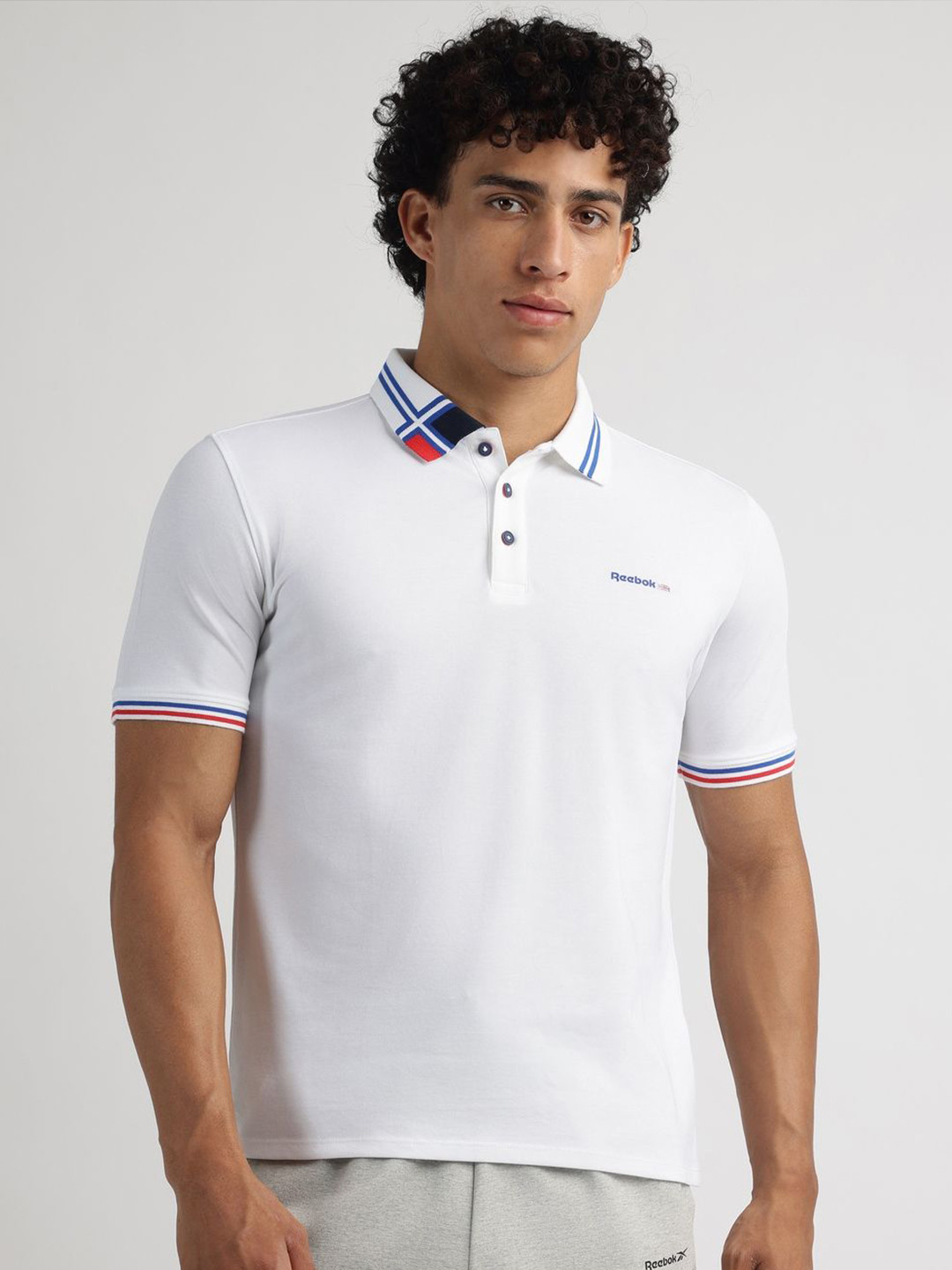 Reebok Men Solid Polo Collar T-shirt