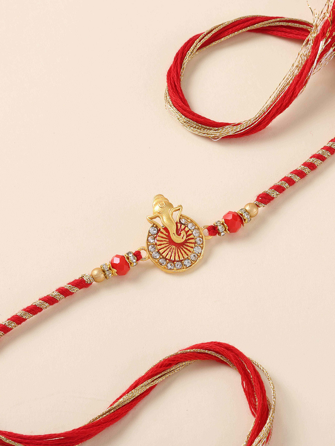 fnp Artificial Stones Studded & Beaded Ganesha Ji Thread Rakhi