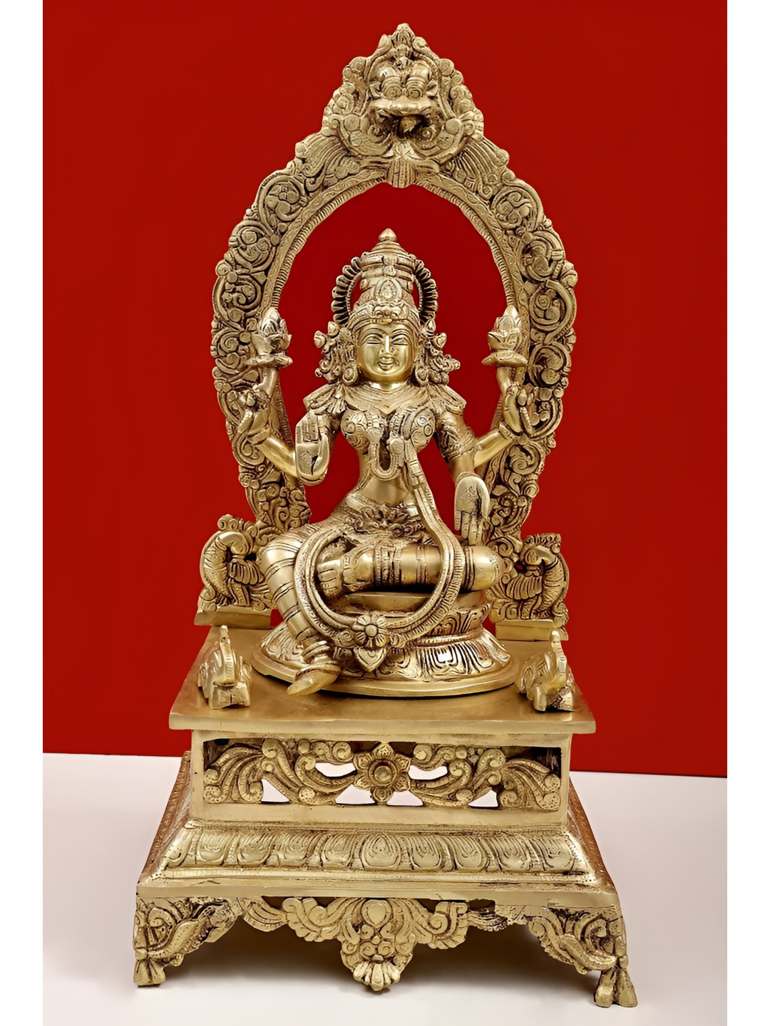 Exotic India Gold-Toned Goddess Lakshmi Sitting On Pedestal Religious Idol Showpiece