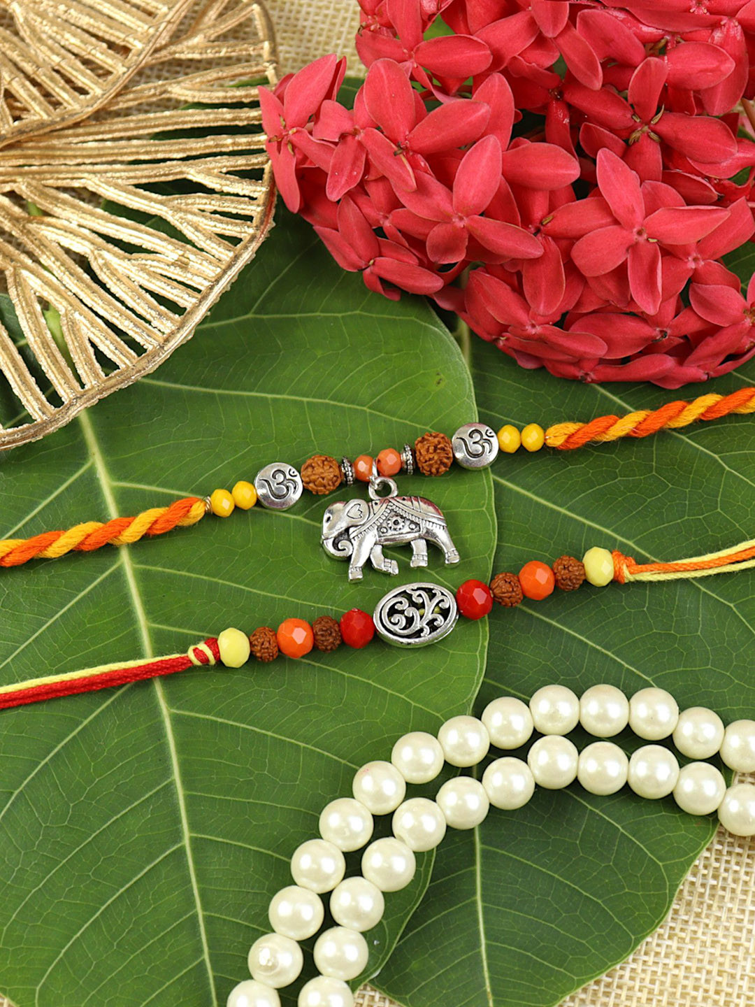 Asthetika Set Of 2 Artificial Beaded Om Thread Rakhis With Roli Chawal