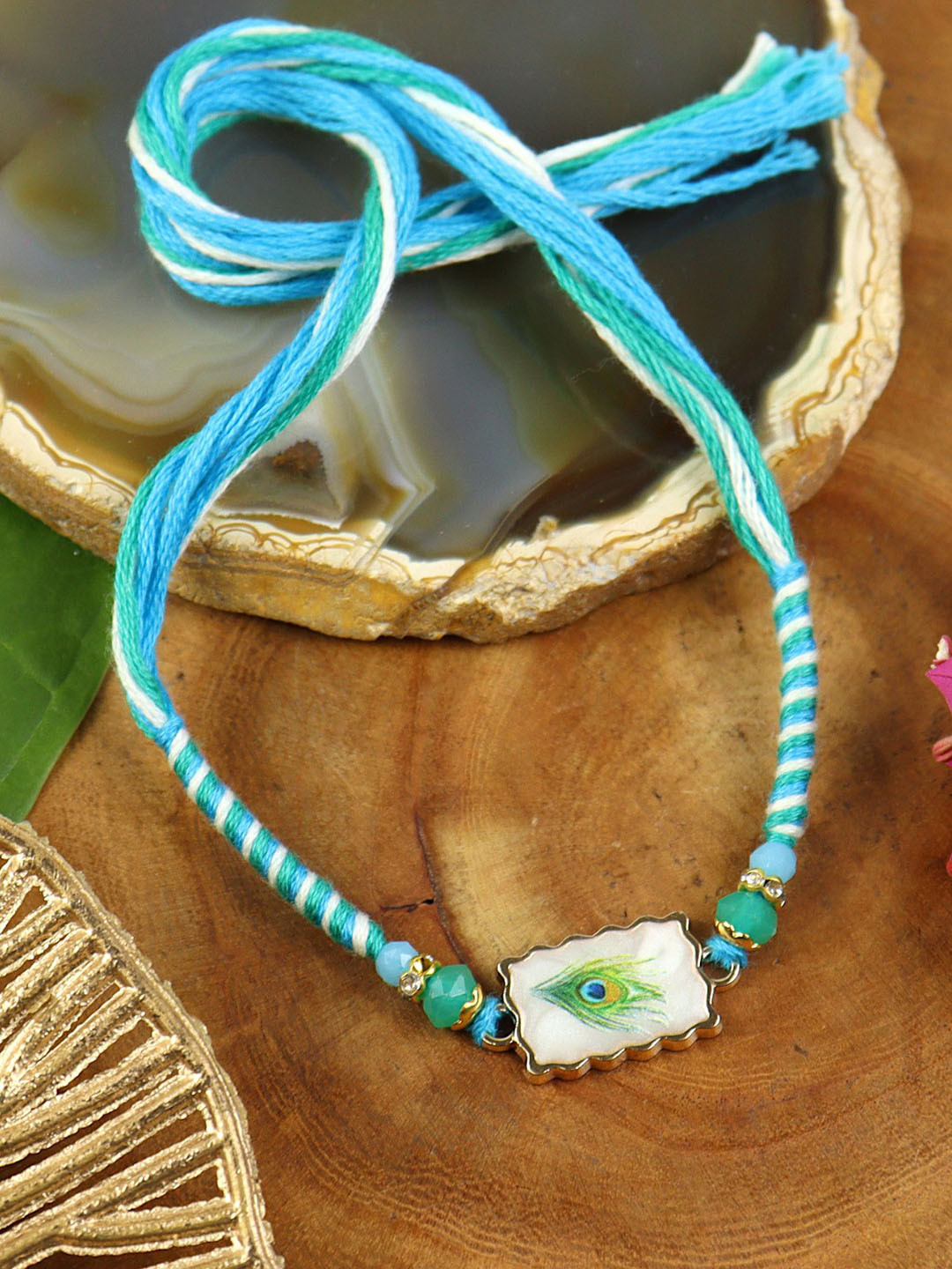 Asthetika Stones Studded And Beaded Peacock Weaved Thread Rakhi With Roli Chawal