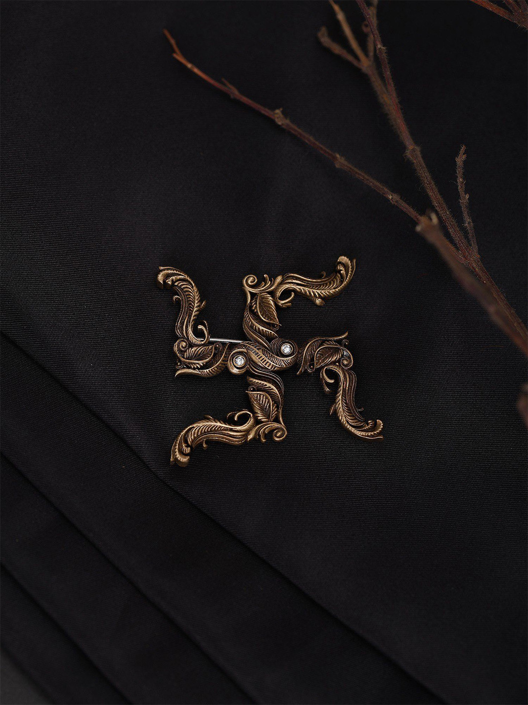 Exotic India Stone Studded Leaf Pattern Swastik Brooch