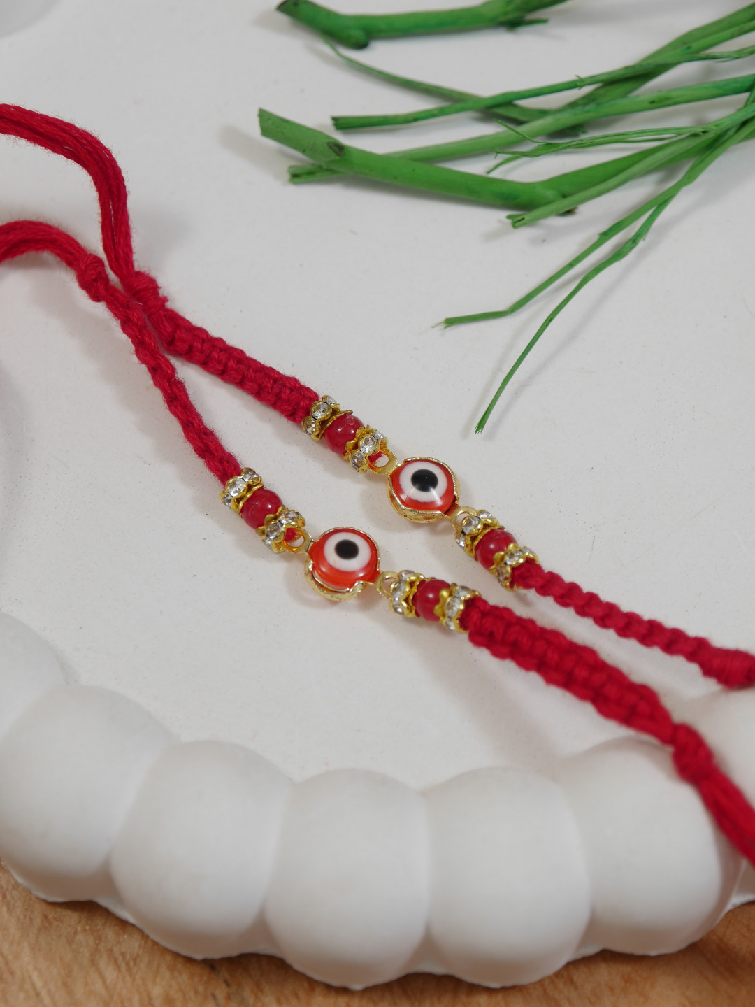 I Jewels Set Of 2 Red & Gold Toned Enamel Evil Eye Rakhi with Greeting Card & Roli Chawal