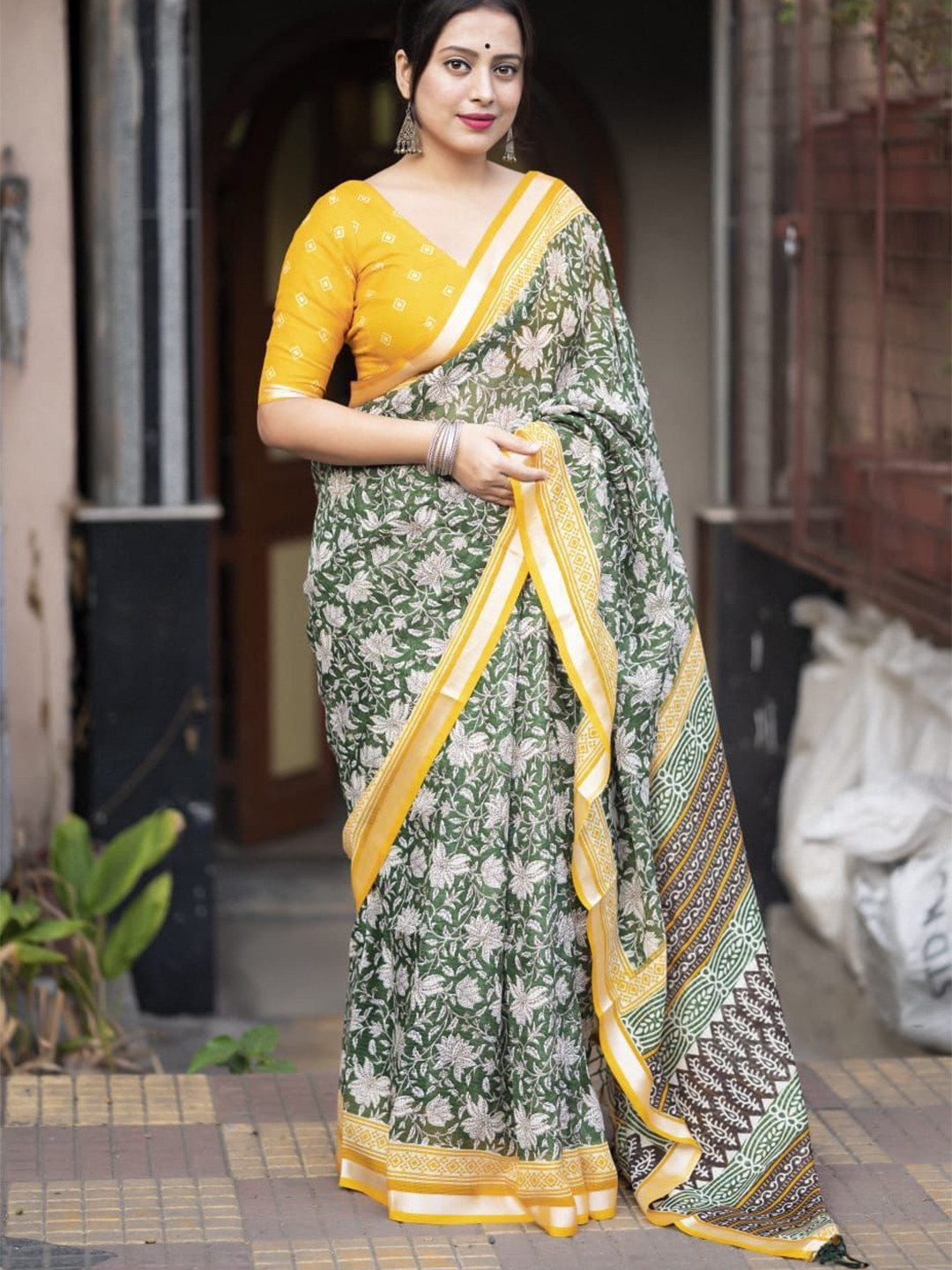 Swaraas Ajrak Print Ikat Saree with Zari Pattu Border