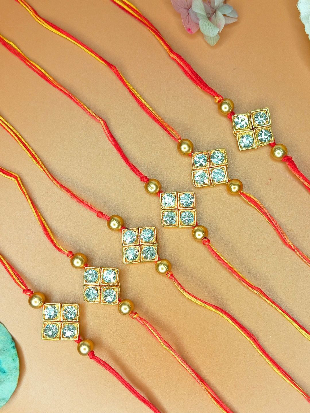 Anouk Set Of 12 Diamond  Studded And Beaded Thread Rakhis With Roli And Chawal & Card