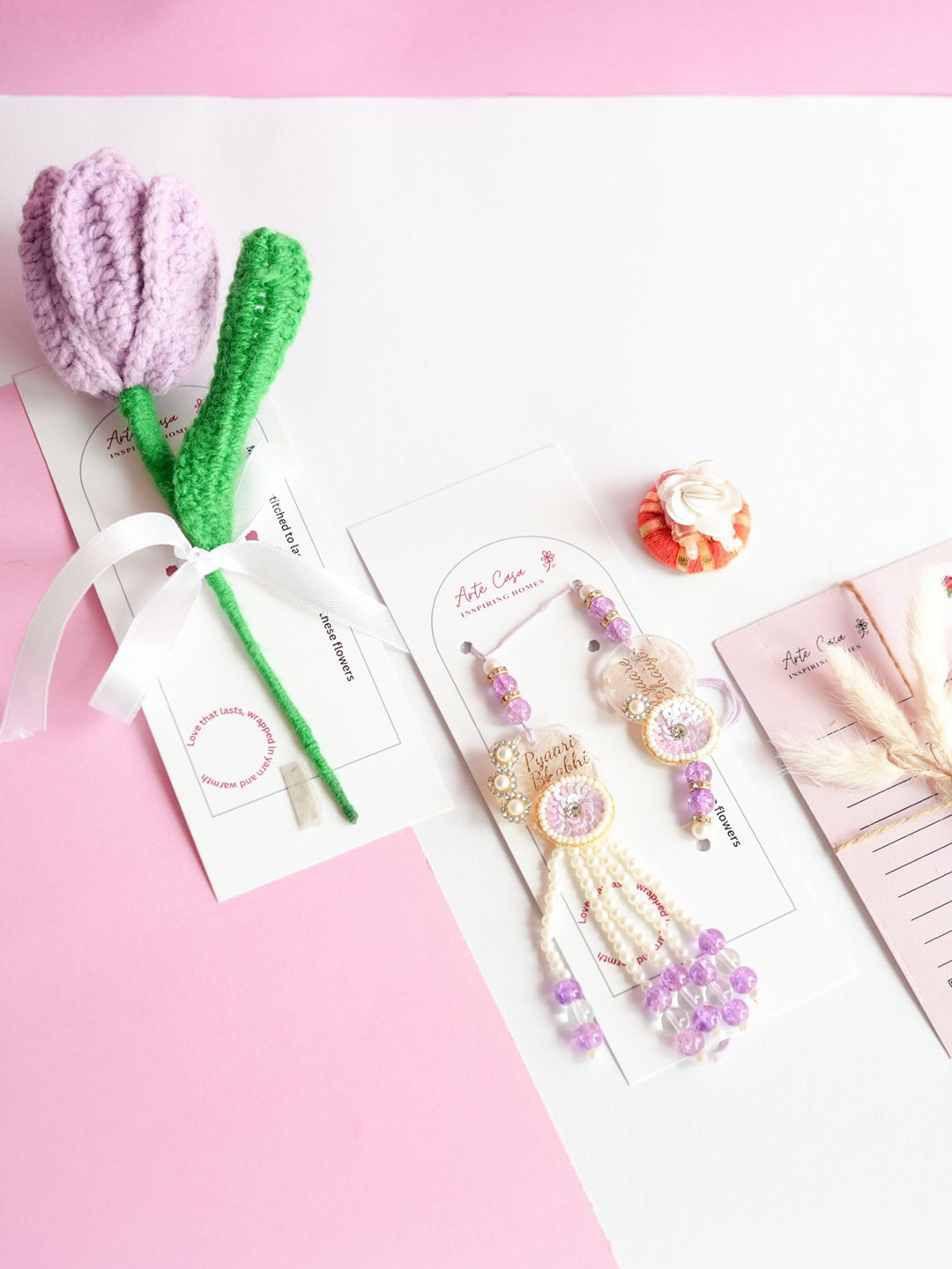 ArteCasa 2-Pcs Rakhi With Flower With Greeting Card & Roli Chawal