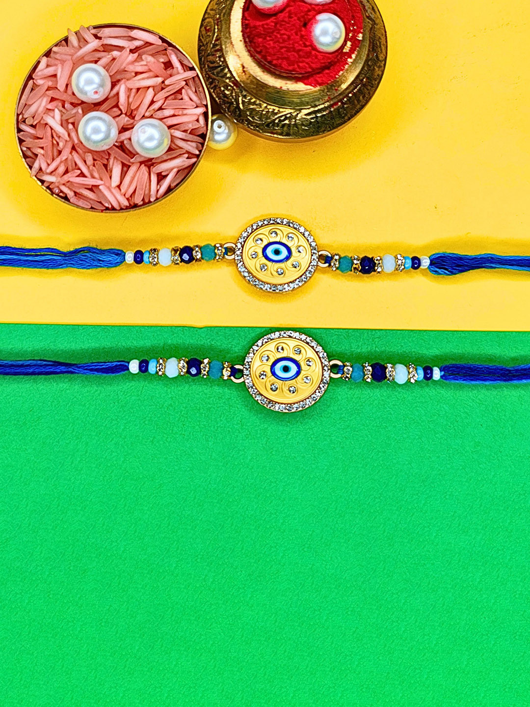 ORANGENYSHA Set Of 2 Beaded Evil Eye Cotton Thread Rakhi With Rholi Chawal