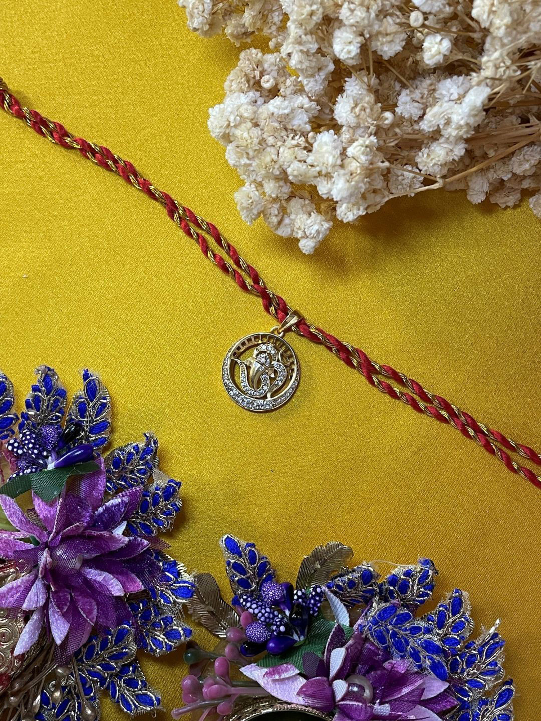Digital Dress Room AD Studded Ganesha & Om Pendant Thread Rakhi