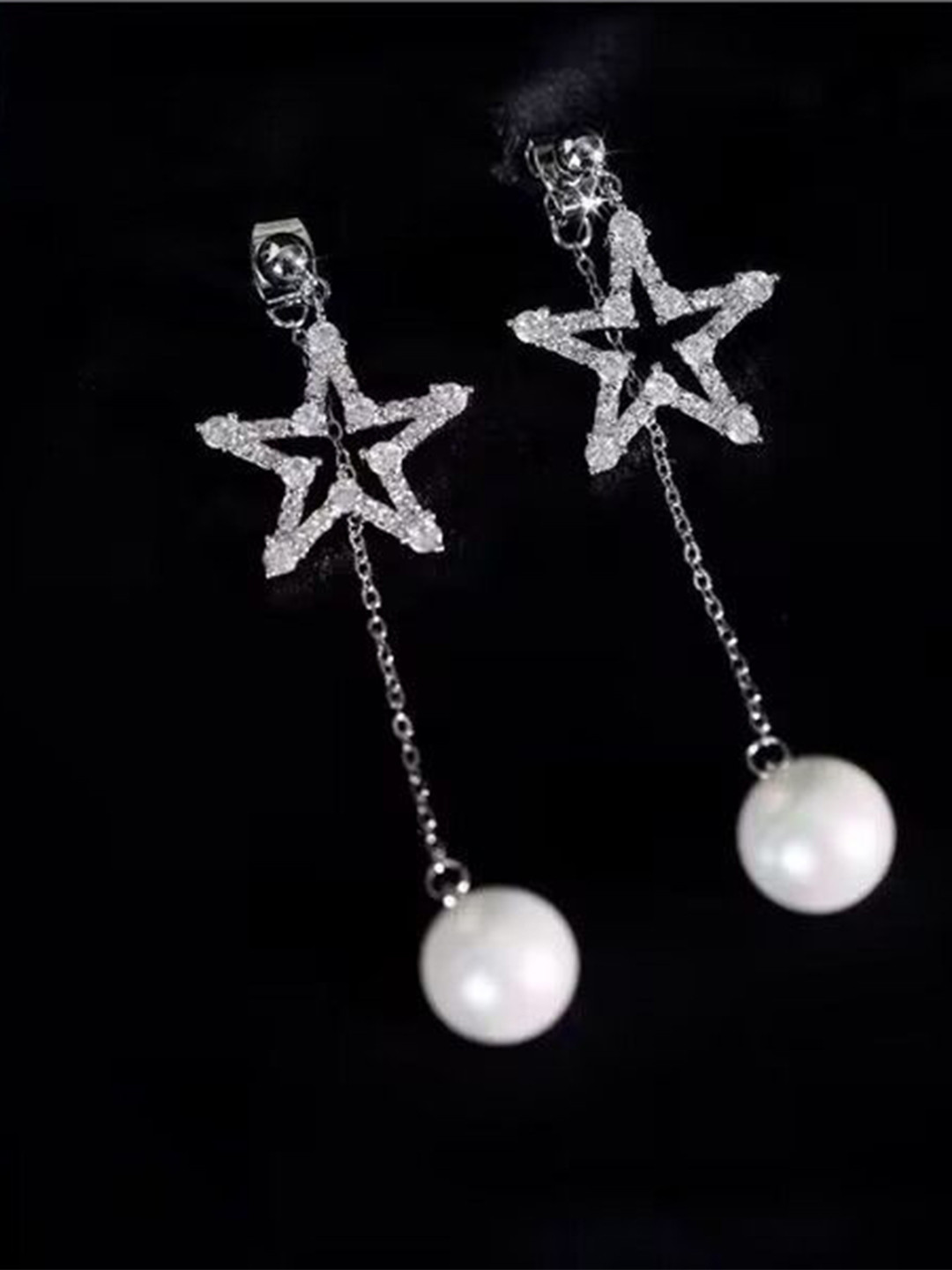 DIVASTRI Silver-Plated American Diamond Studded Korean Star Shaped Drop Earrings