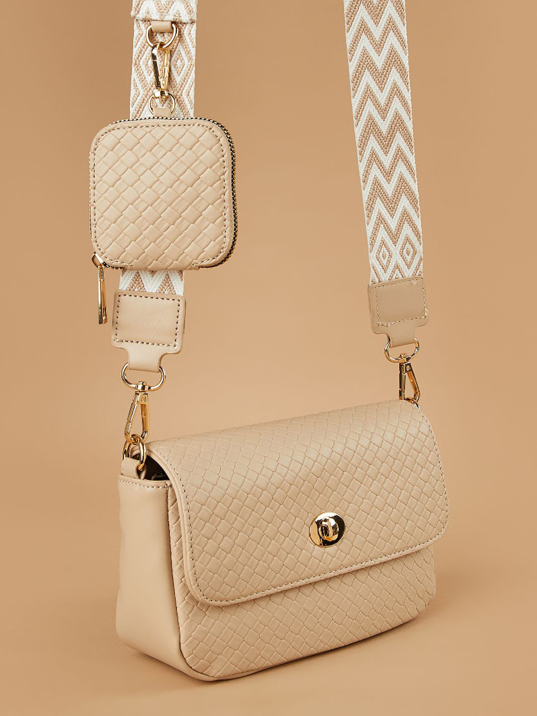 CODE by Lifestyle Women Textured Baguette Tasselled Sling Bag with Pouch