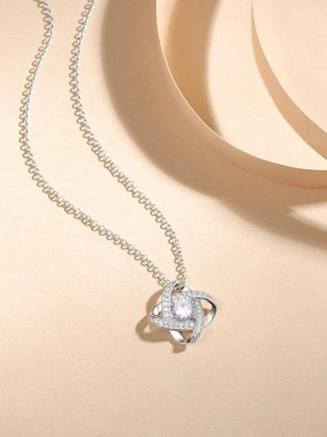 SID PARI SALLER Stainless Steel Silver-Plated Stones Studded Love Knot Pendant with Chain