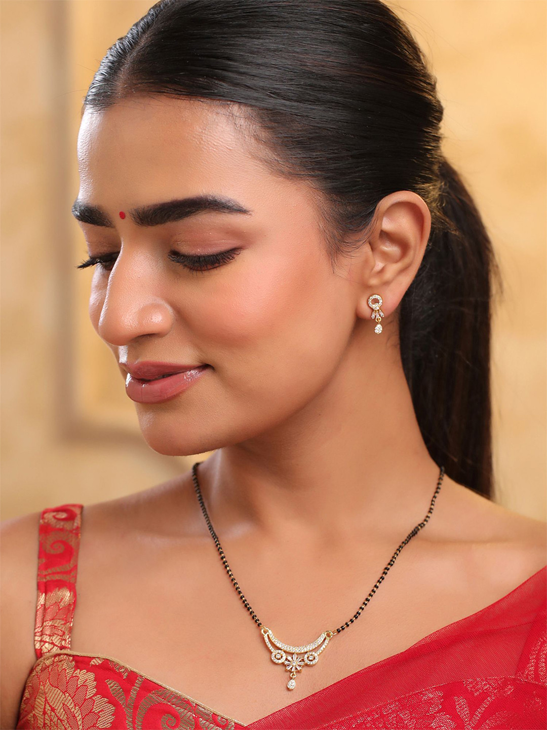 Yellow Chimes Gold-Plated American Diamond Studded & Beaded Mangalsutra With Earrings