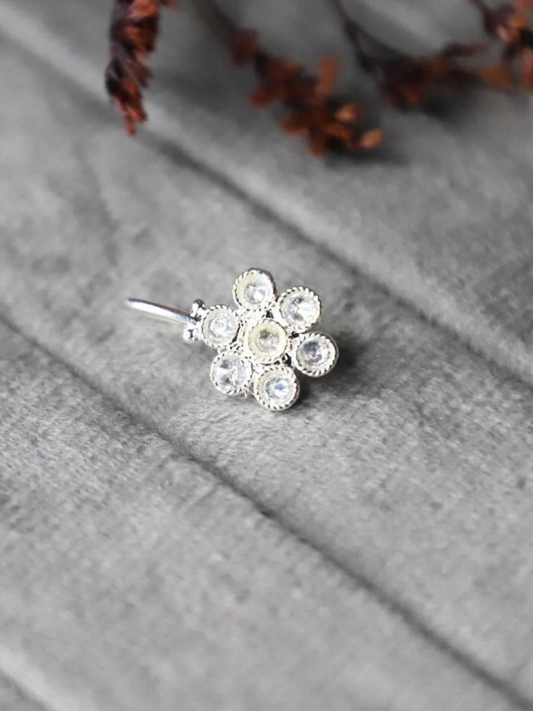 Sangria Silver-Plated Artificial Stone Studded Floral Desgin Stud Nosepin