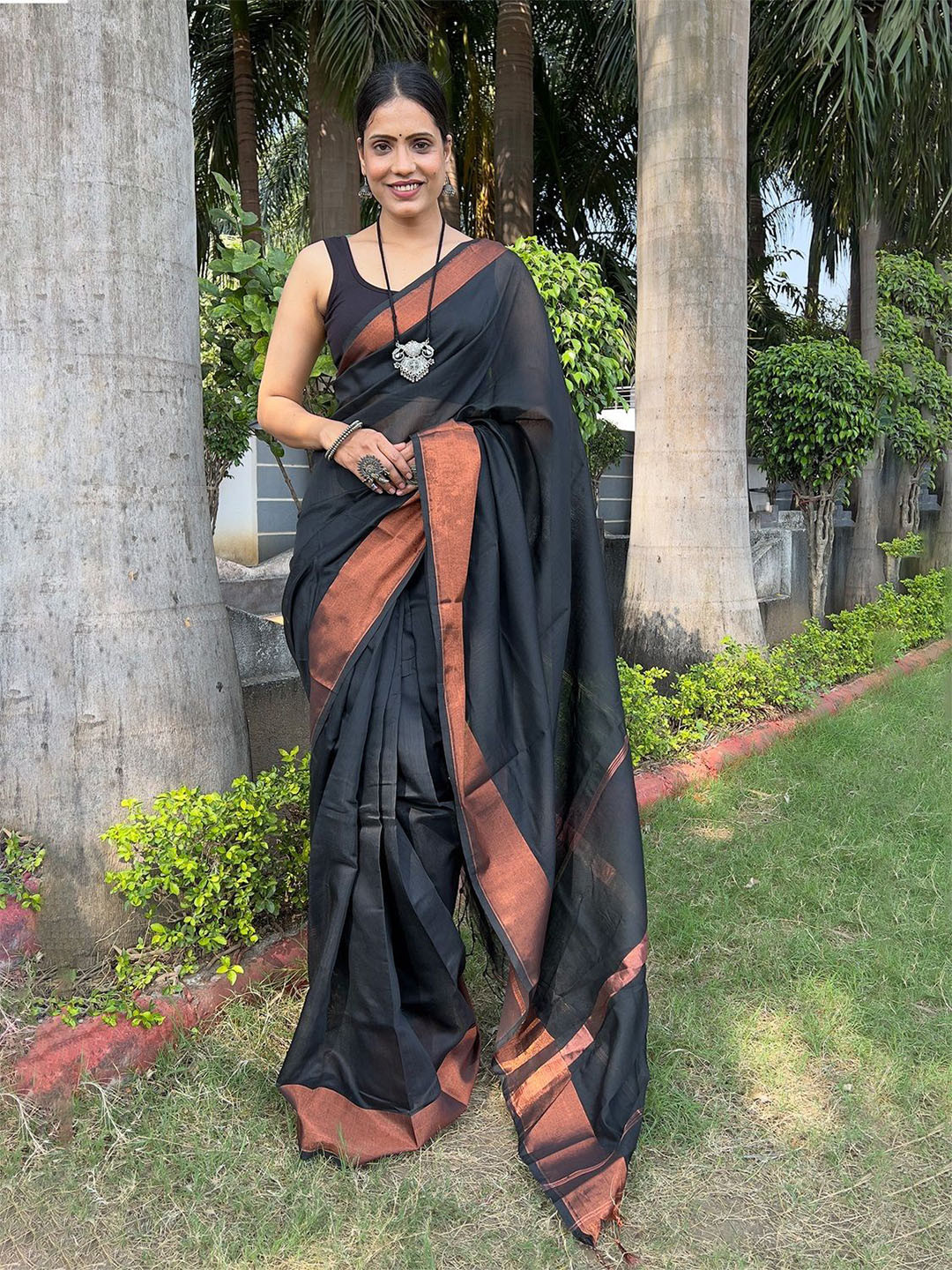 Anouk Solid Black Saree With Woven Design Zari Border