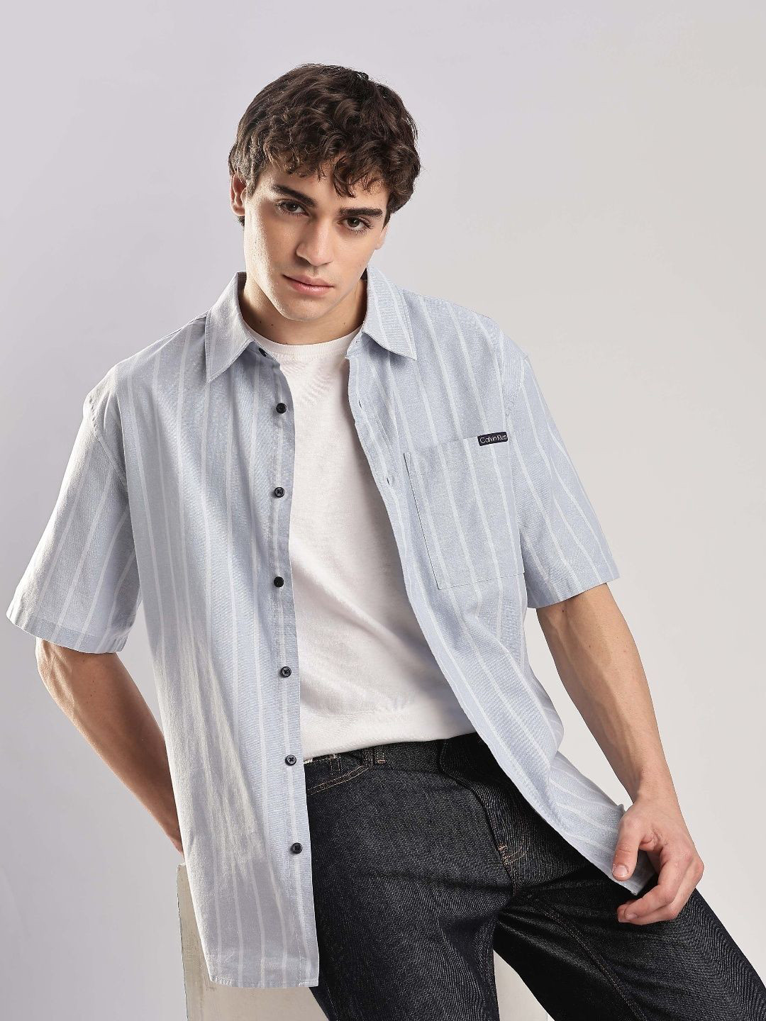 Calvin Klein Jeans Men U.S Relaxed Fit Spread Collar Vertical Striped Cotton Casual Shirt