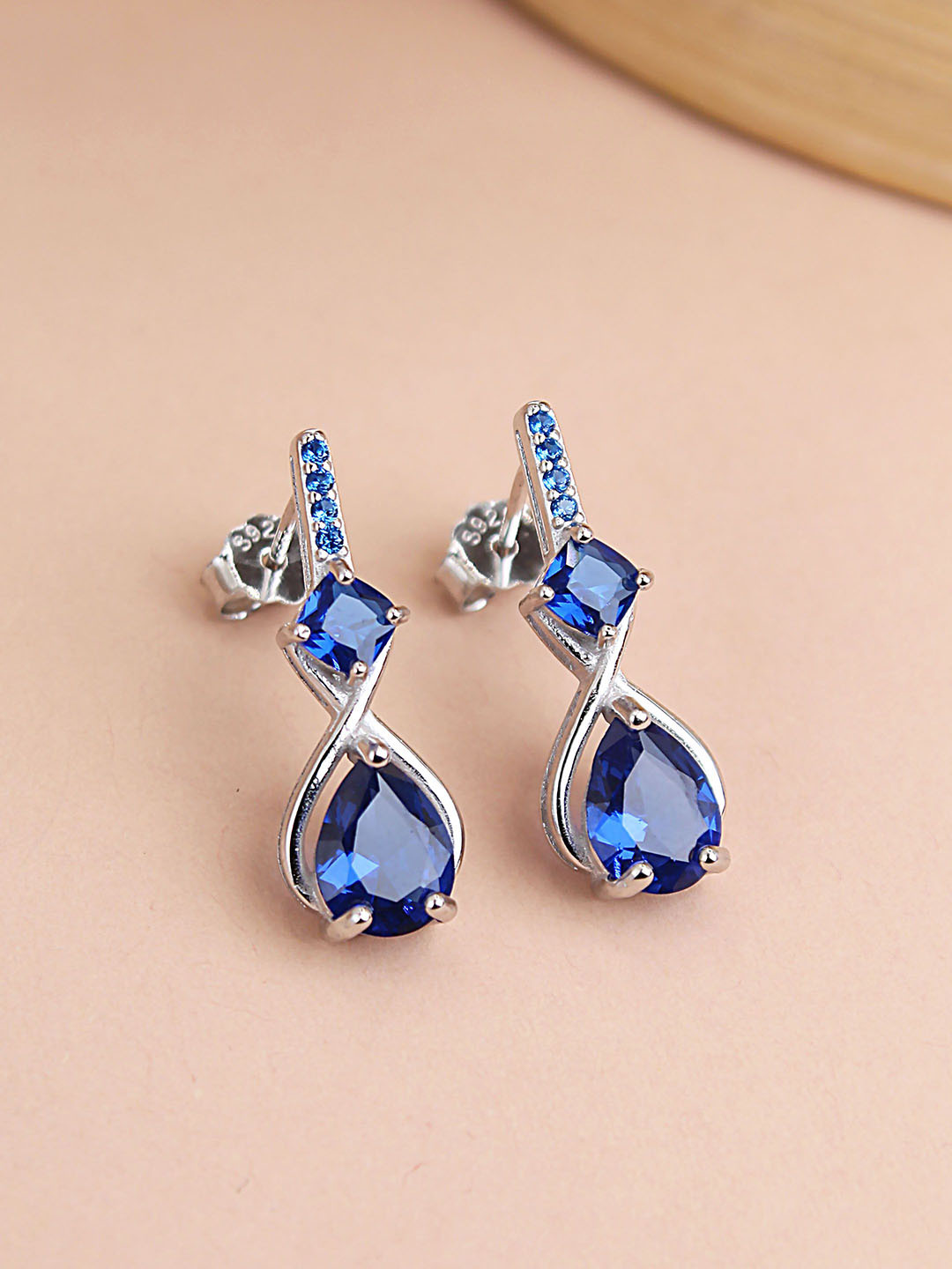 DEVASHREE 925 Silver Rhodium-Plated CZ & Sapphire Studded Twisted Pear Drop Earrings