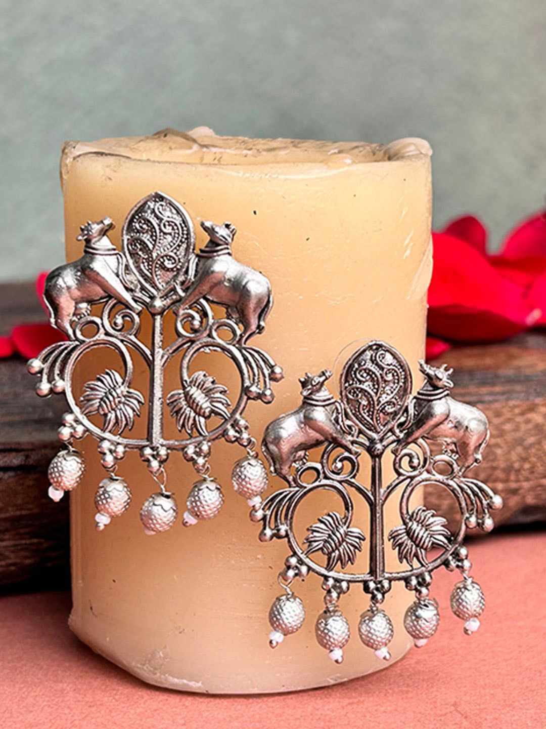 The Advitya Silver Tone Cow Shaped Drop Earrings