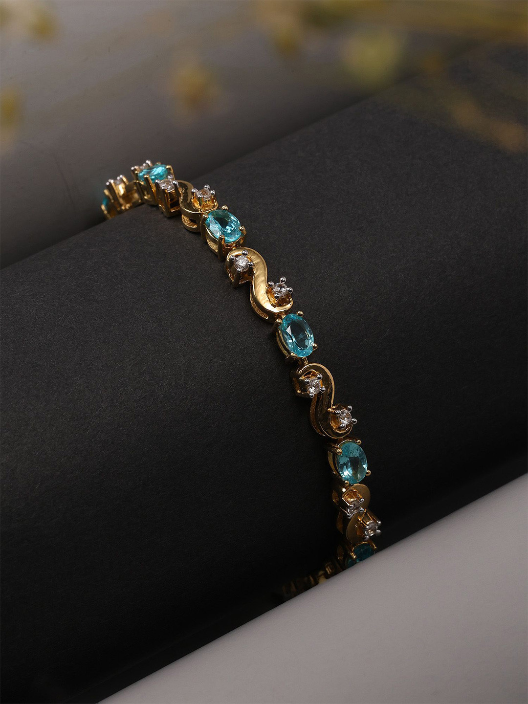 Exotic India Sterling Silver Oval Shape Faceted Apatite Tennis Bracelet