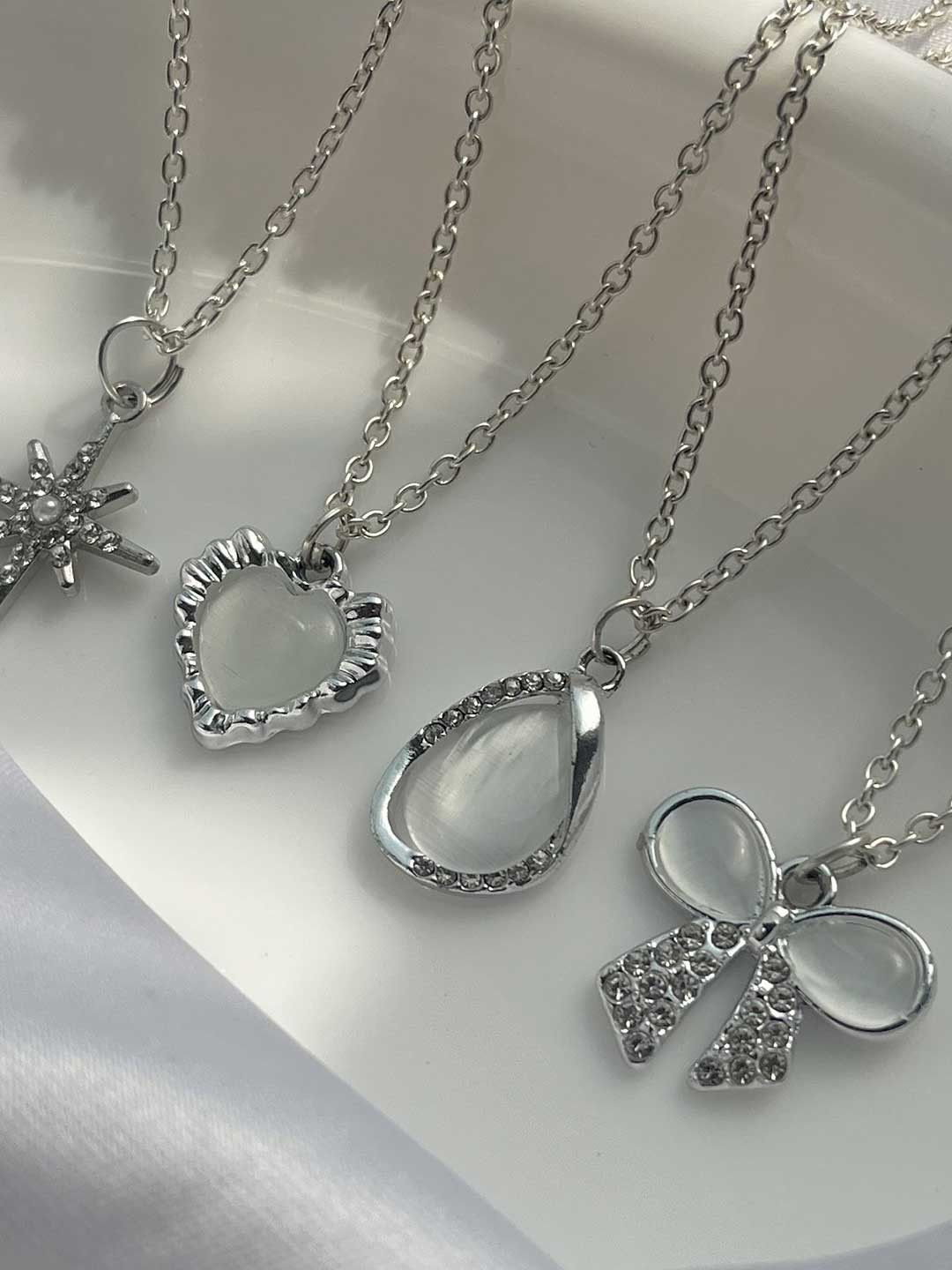 Jewelsbysirani Set Of 4 Silver-Plated American Diamond Studded Pendants With Chains