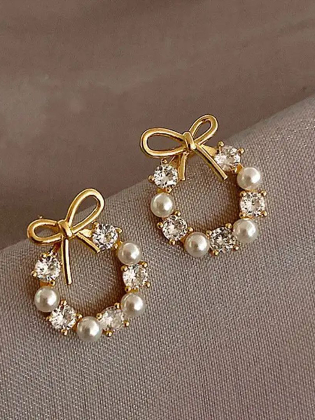 Estailo fashion Gold-Plated Artificial Stone Studded Alloy Bow Circular Studs