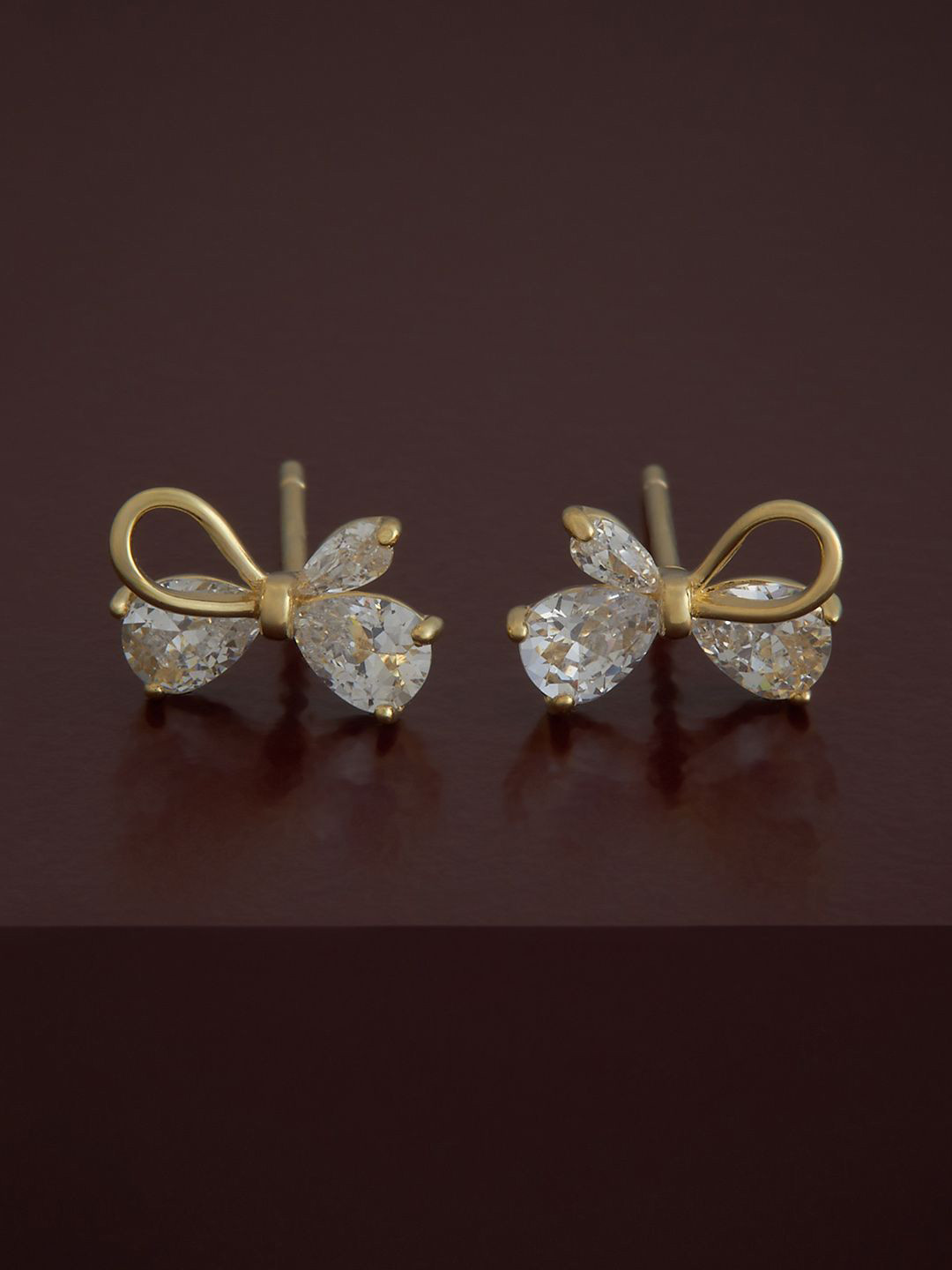 Kushal's Fashion Jewellery 92.5 Pure Silver Gold-Plated Zircon Studded Bow Shape Studs