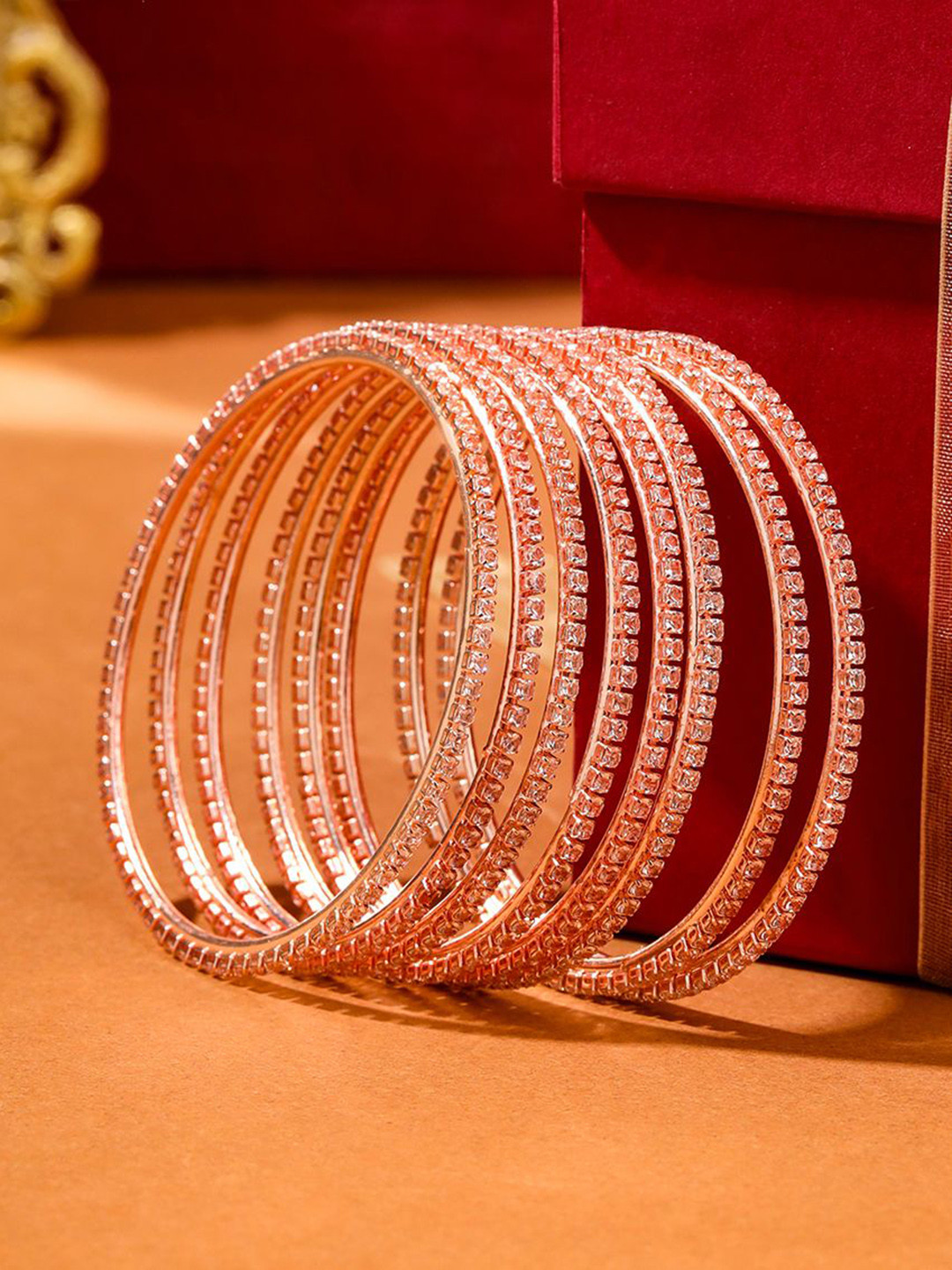 NVR Women Set Of 8 American Diamond Rose Gold Plated Bangles