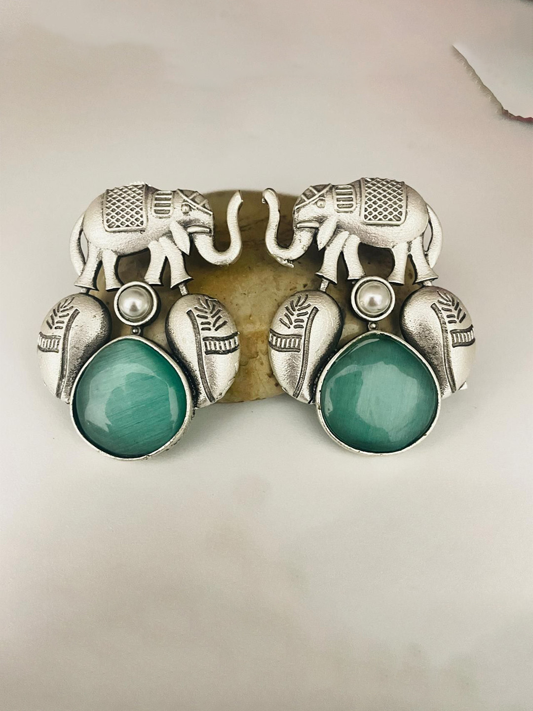 MONI LIFESTYLE Silver Plated Artificial Stones Studded Animal Shaped Studs