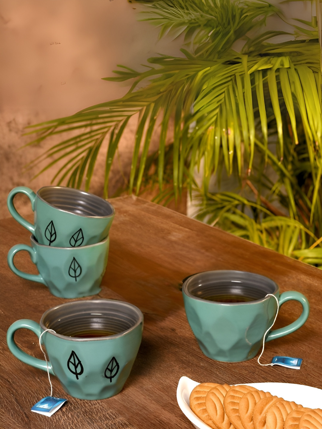 Unravel India Collapsible Blue Leaf Ceramic Handmade 4 Piece Mugs-150ml