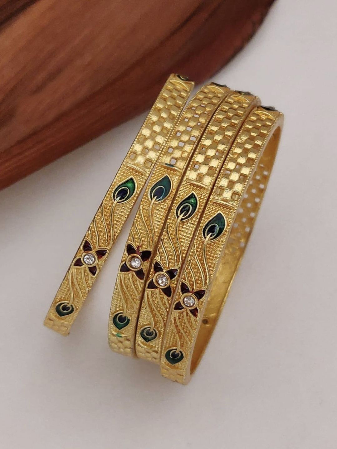 Vani Enterprise Set Of 4 Gold-Plated Stone Studded Meenakari Bangles
