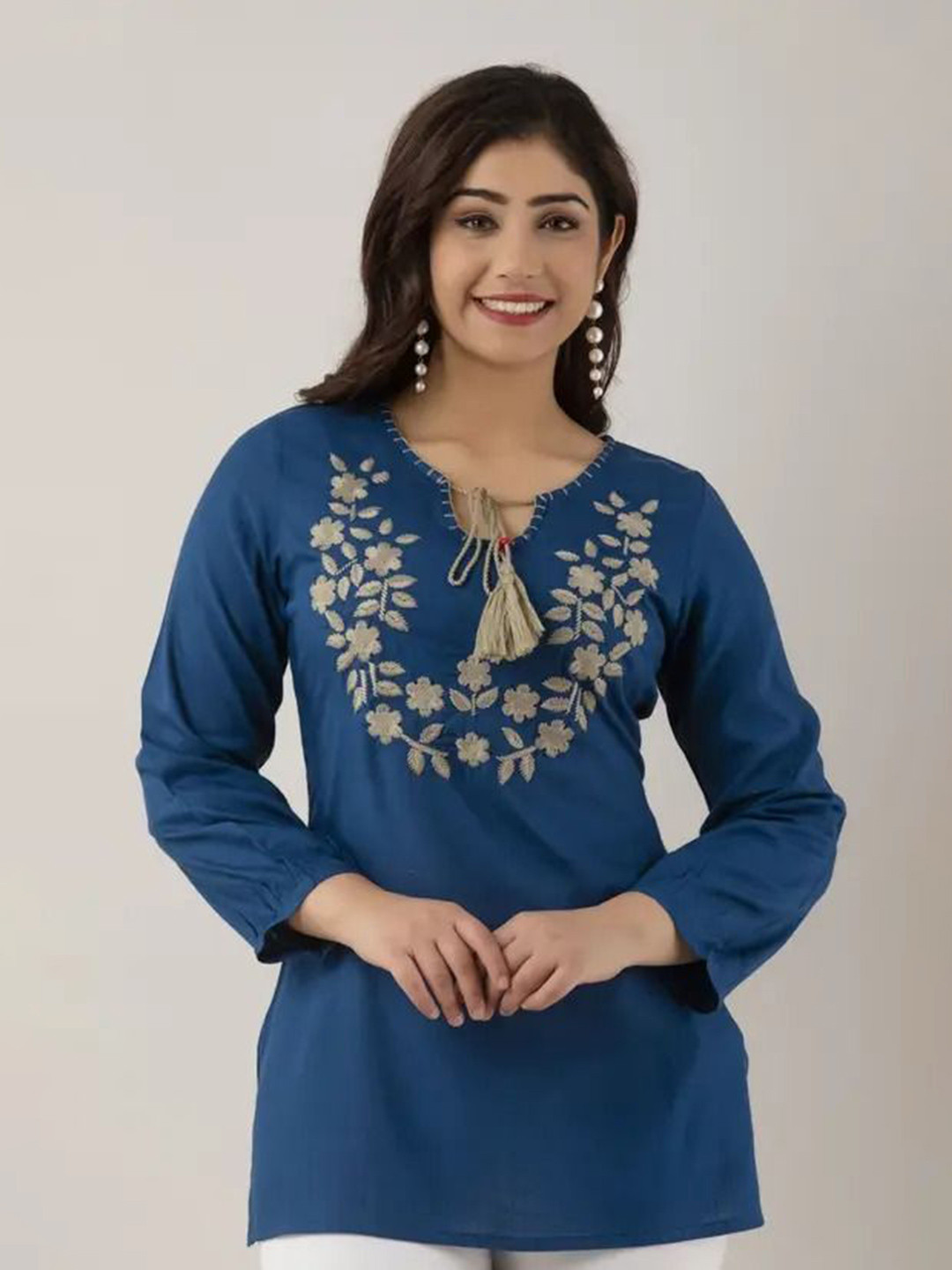 Naida Women Floral Embroidered Tie-Up Neck Straight Kurti