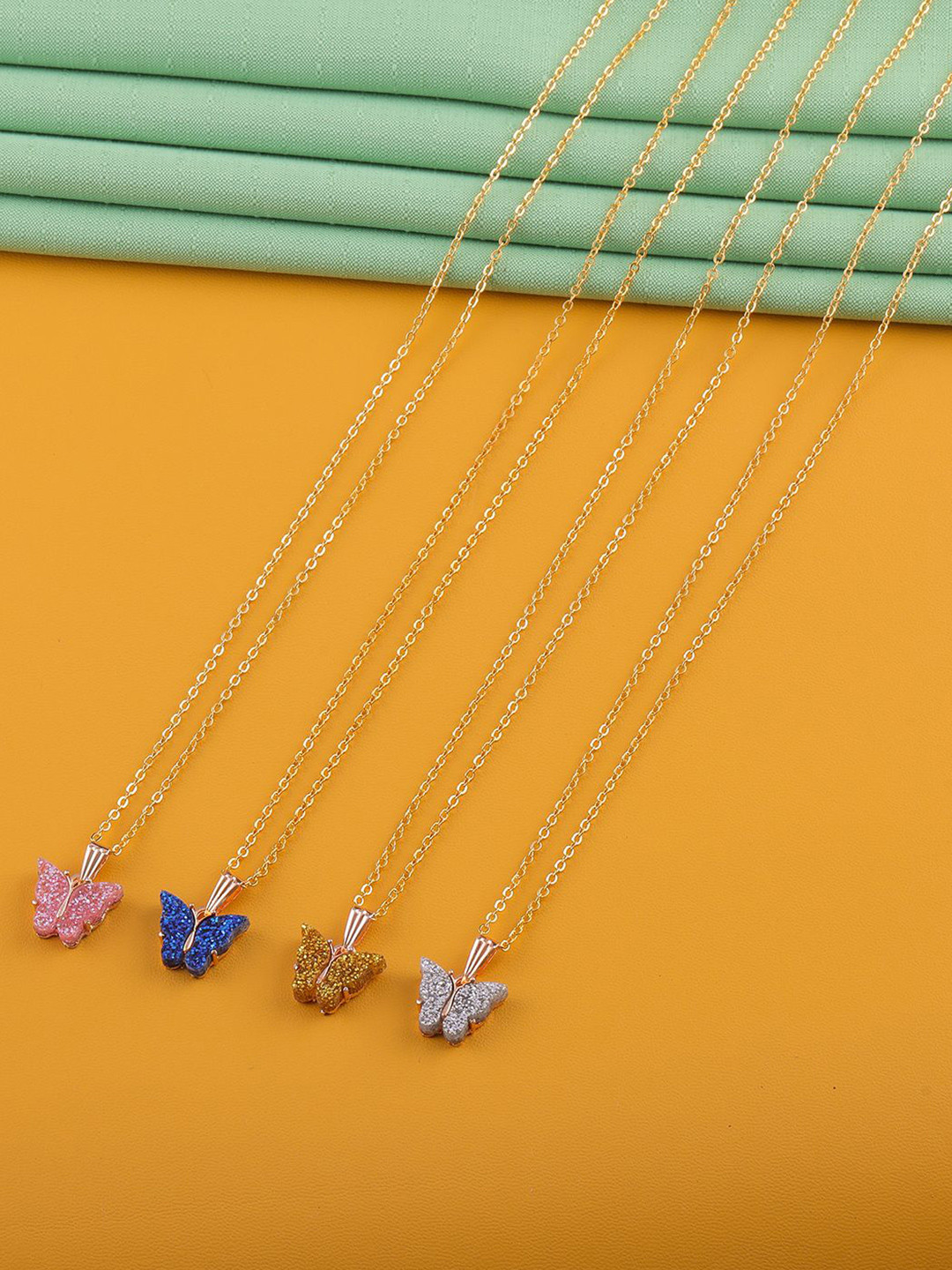 DressBerry Set of 4 Gold-Plated Butterfly Pendants With Chains