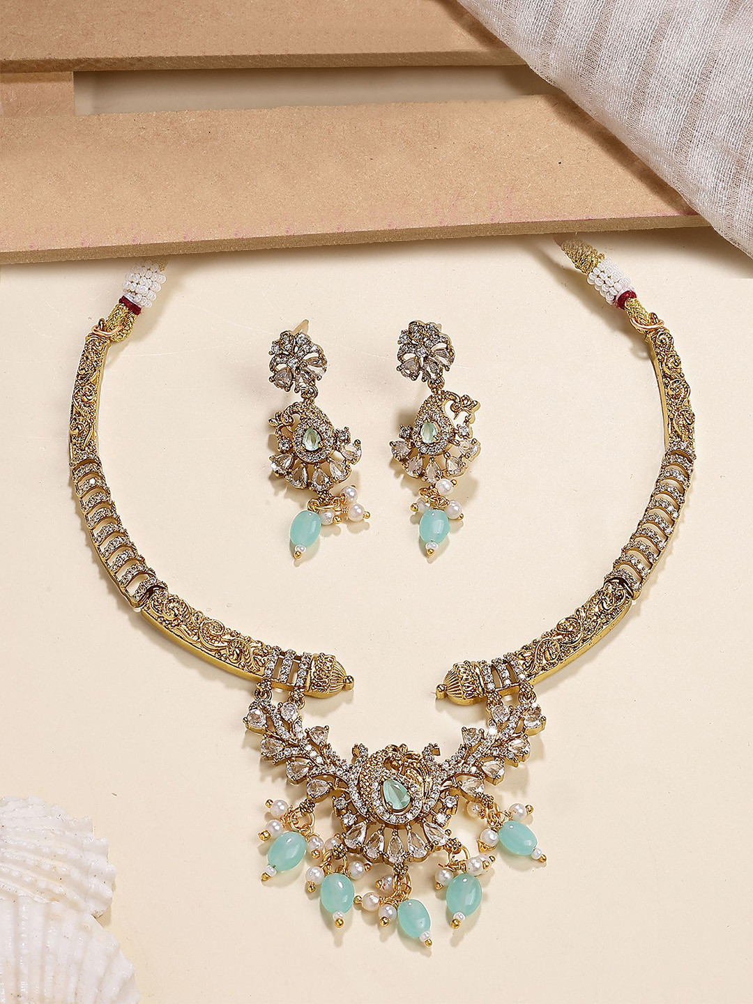 KARATCART Gold-Plated American Diamond Studded & Beaded Peacock Design Jewellery Set