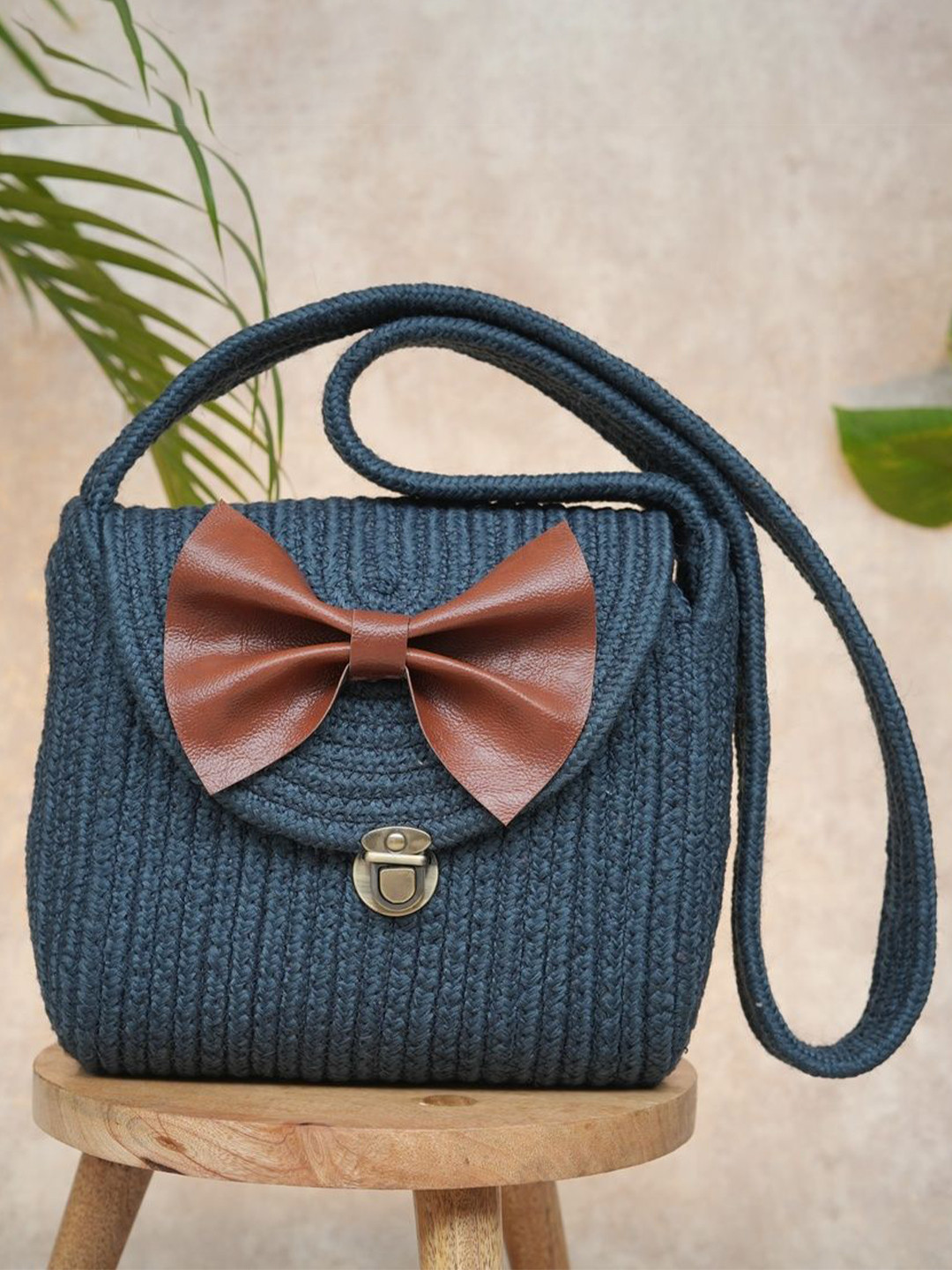 Ariya Women Blue Cotton Blend Sling Bag with Leather Bow