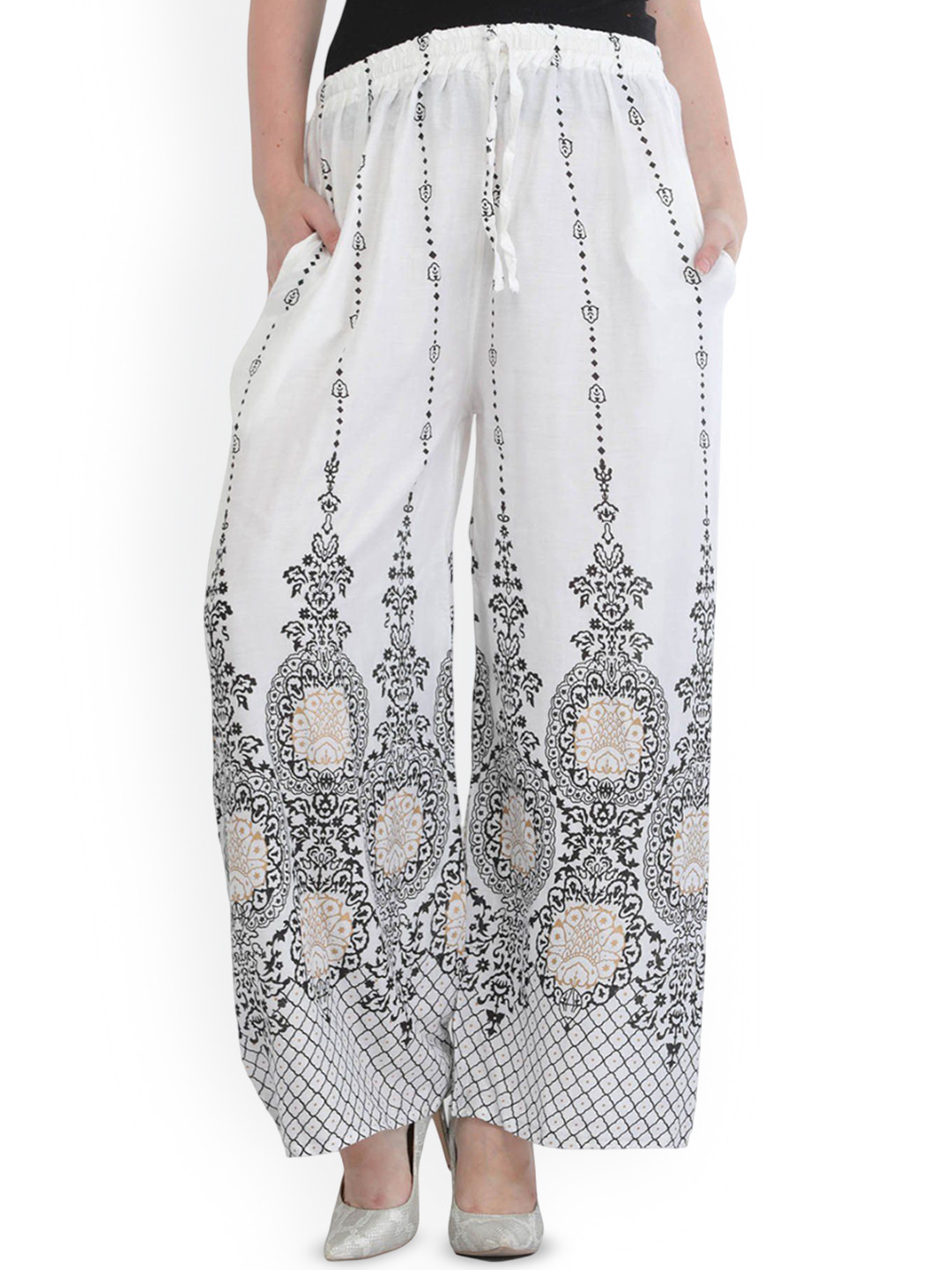 Exotic India Casual Yoga Trousers for Women with Golden Floral Print