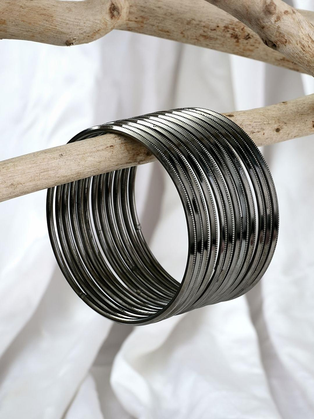 Sangria Silver Plated & Charcoal coloured-Textured Set of 12 bangles