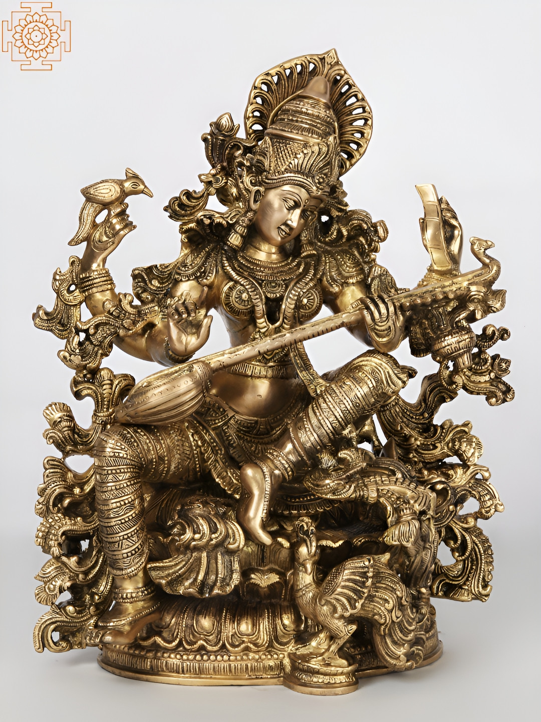 Exotic India Four-Armed Saraswati Playing Veena Gold Brass Metallic Prayer Room Hand Made Medium Showpiece - 17 Inches