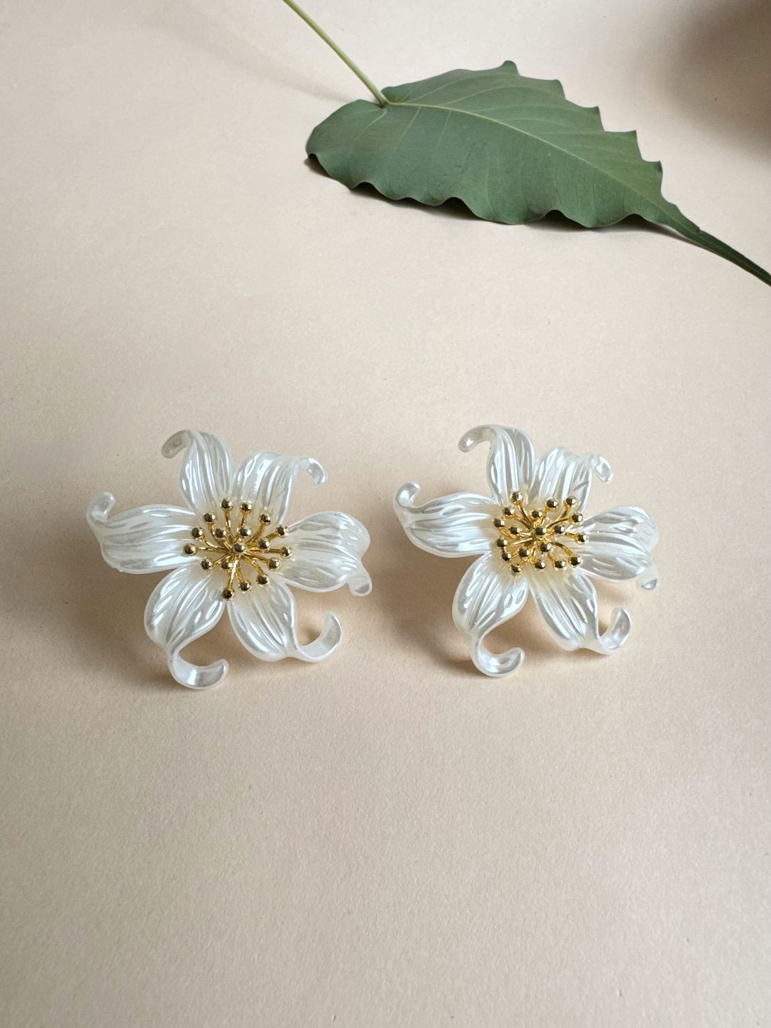 The Jewellery Tale Stainless Steel Gold-Plated Floral Shaped Studs