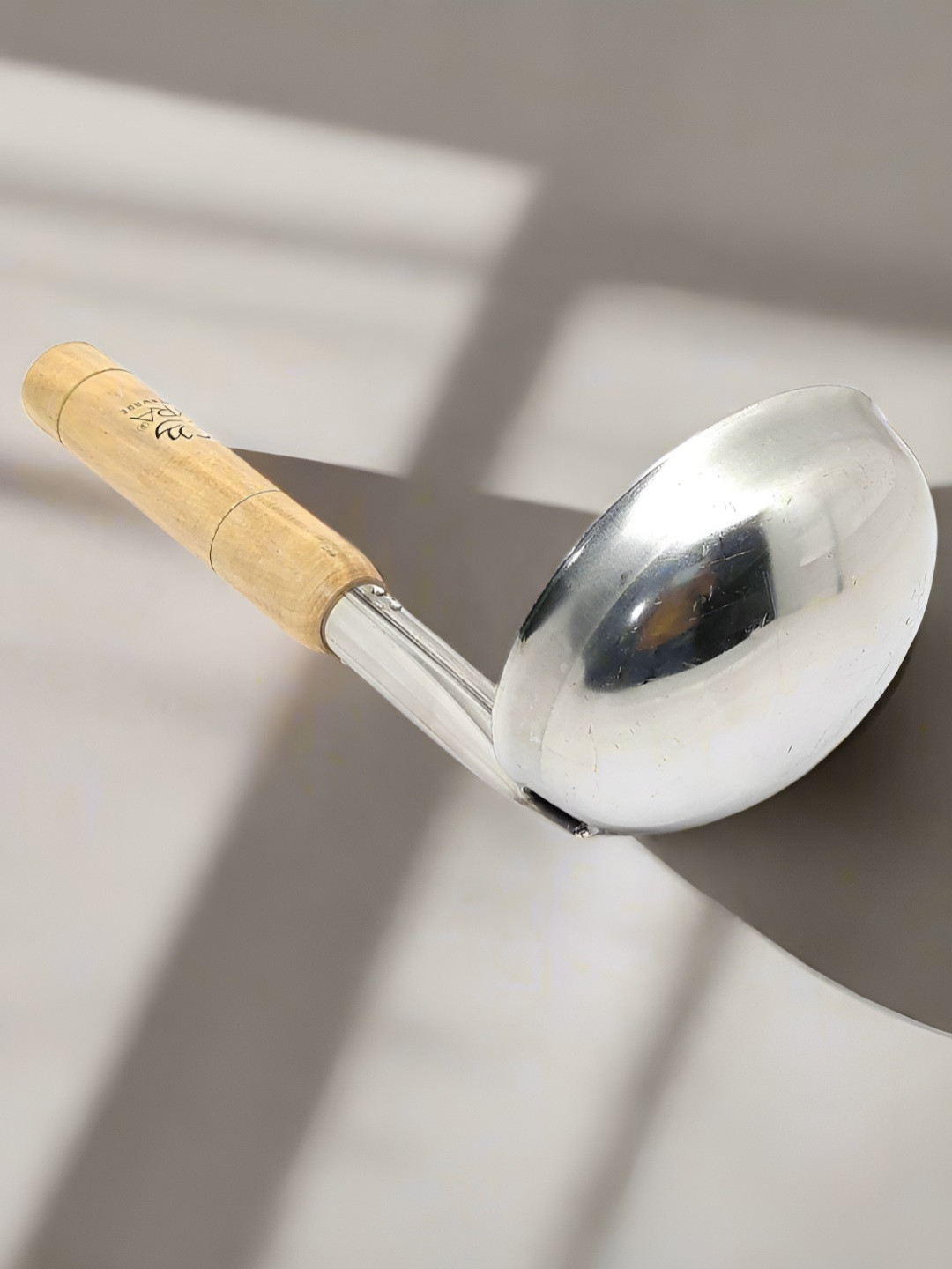 Nyra Kitchenware Silver-Toned & Beige Stainless Steel Ladle With Wooden Handle-400 ml