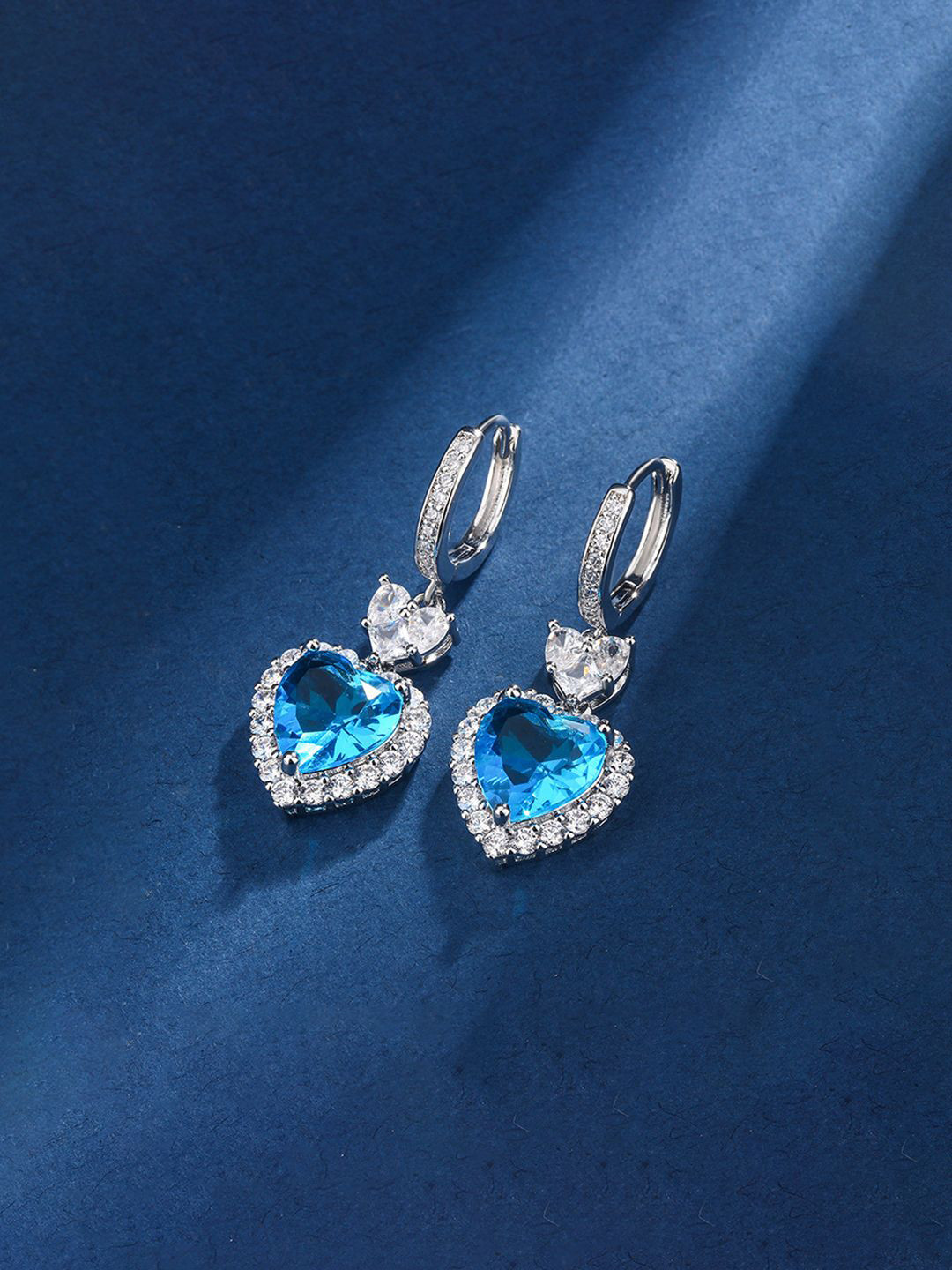 Designs & You Silver-Plated American Diamond Studded Heart Shaped Hoop Earrings